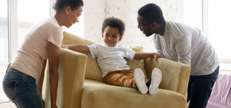 African,Couple,Carrying, new furniture,Armchair,Where,Sit,Adorable,Small,Toddler,Son.