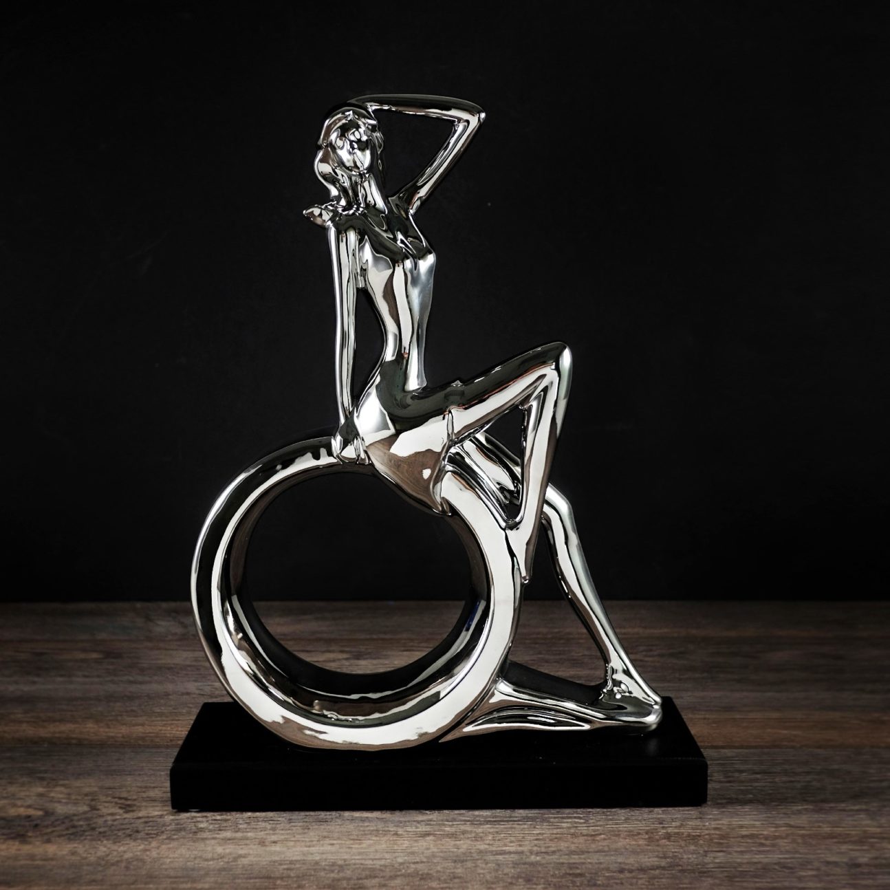 Silver Woman Sitting on Circle Statue